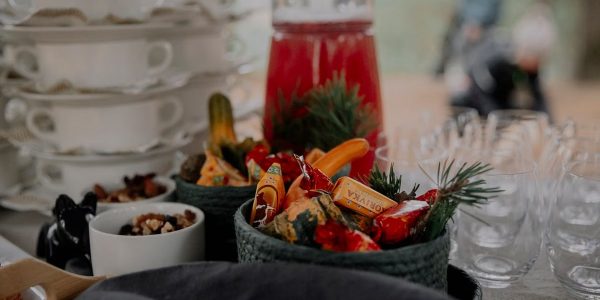 A beautifully arranged table with festive candies and glassware, perfect for a holiday gathering.